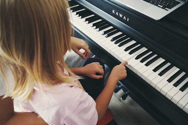 Piano lesson — hands on piano keys